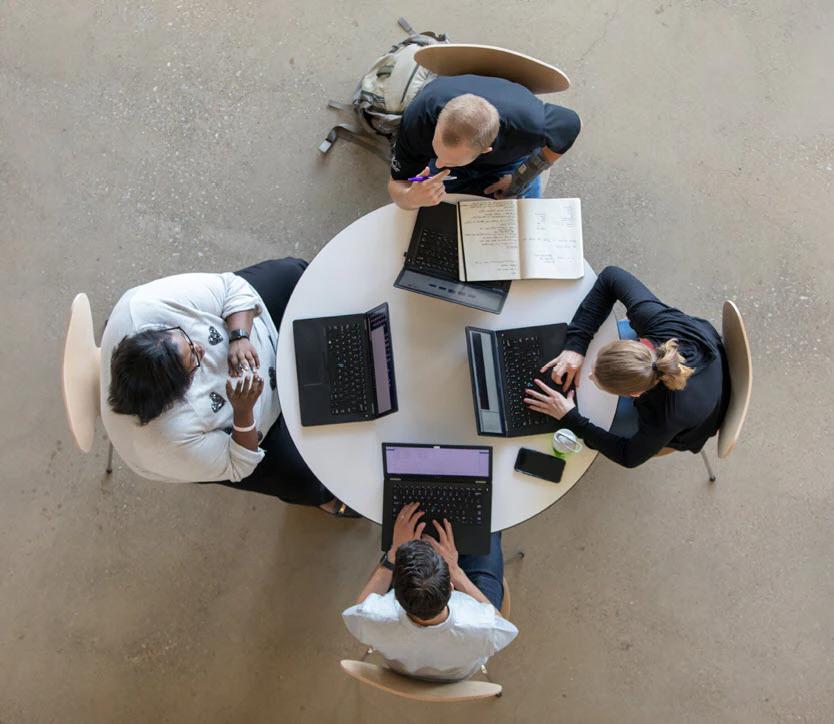 4 people sitting at a round table